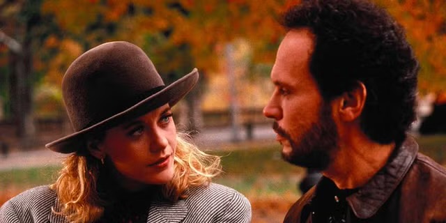 Harry and Sally from “When Harry Met Sally” walk in a leaf-strewn park as they chat. Read more for other fall movie recommendations.