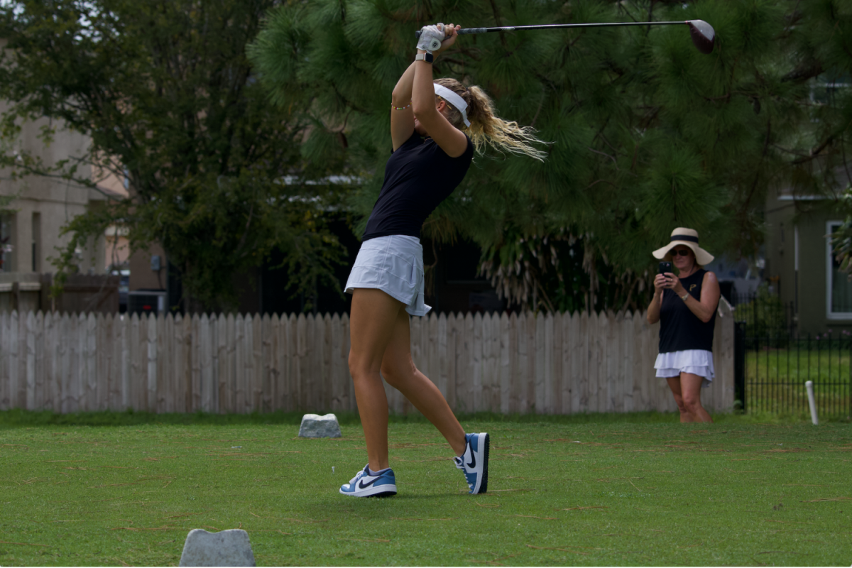 Audrey Roberts (9) finishes her tee shot at a match against Alonso High School on Oct. 1. Roberts broke 40 at the match with a final score of 39 strokes through nine holes.