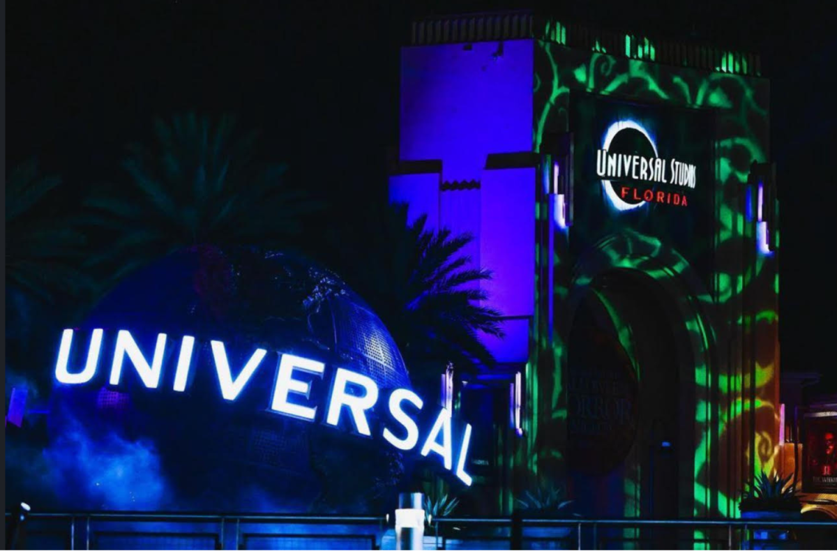 The entrance sign to Universal Orlando's Halloween Horror Nights 2024 welcomes guests to an evening of fright and fun. This year's event promises new haunted houses, scare zones, and immersive experiences that are sure to thrill attendees. 