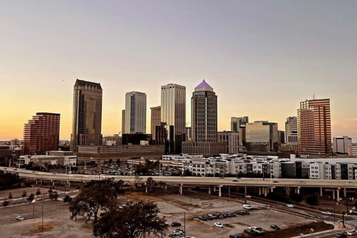 The sun sets over Tampa’s downtown. The city is a popular summer destination for families and friends. 