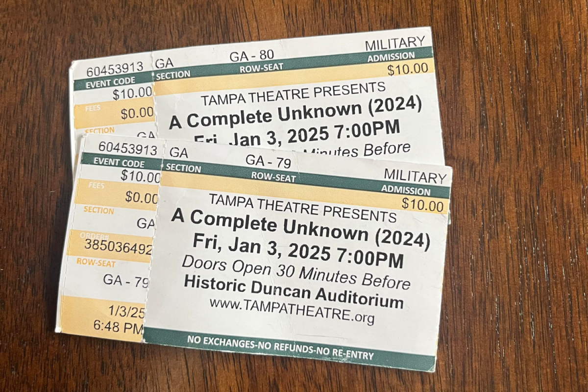 My Tampa Theater tickets for “A Complete Unknown” sit on a table. Shortly after, my mom threw the tickets away.
