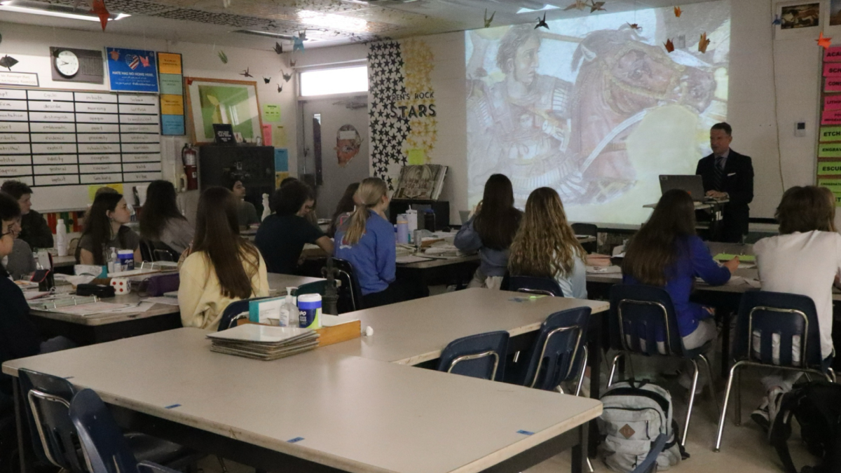  William Renninger is teaching his class about a new artwork they have to know for an upcoming test. Renninger has been a teacher at Plant for over a decade. 
