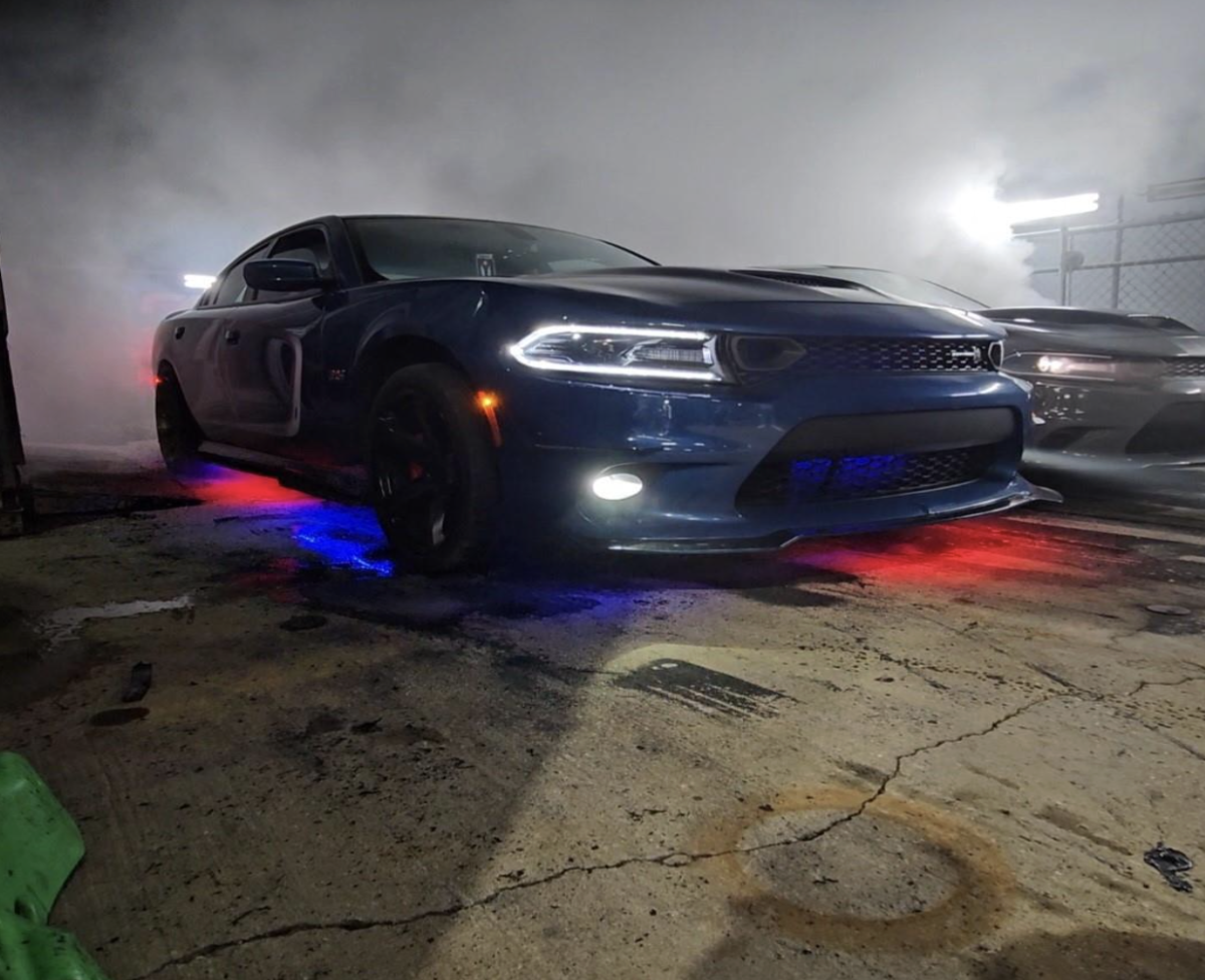 A Dodge HellCat is in the “pit” doing a burn out. Tampa, Fl hosted a car show on Saturday, Oct. 18. 