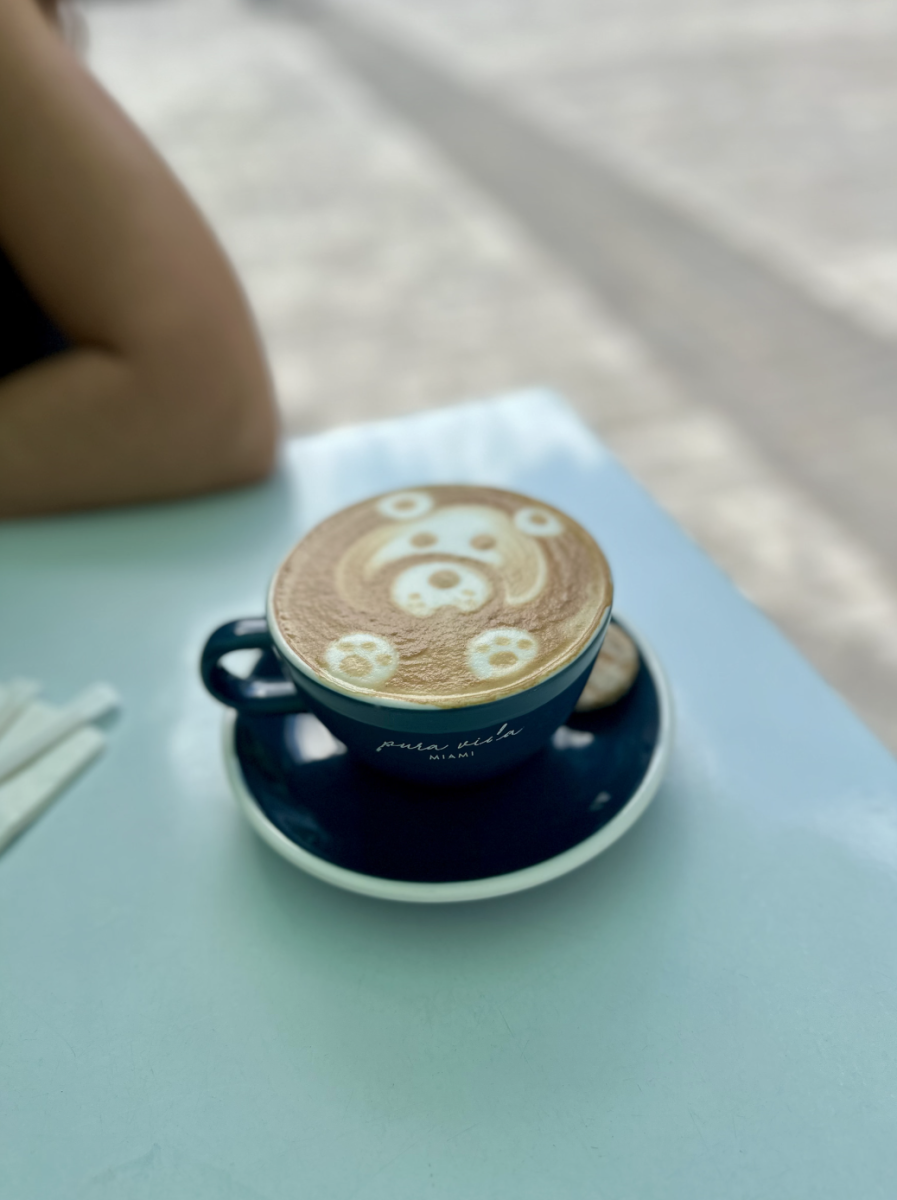 A fresh cup of coffee sits on a table at a local coffee shop, a daily stop for many students before heading to school. The growing reliance on caffeine has turned places like this into essential study and energy hubs for teens. 