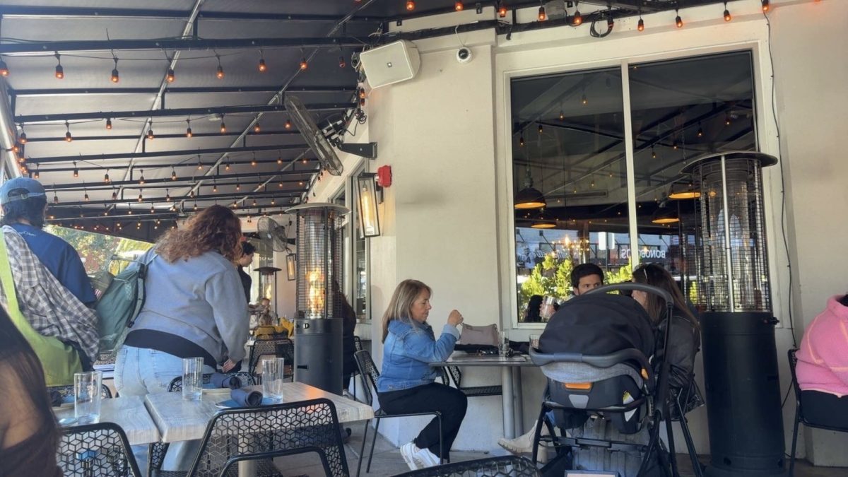 People are shopping at different stores and dining at restaurants in Hyde Park Village. Recently, people have noticed an increase in the prices of various items and the opening of new shops, which shapes their behavior when spending their time and money.