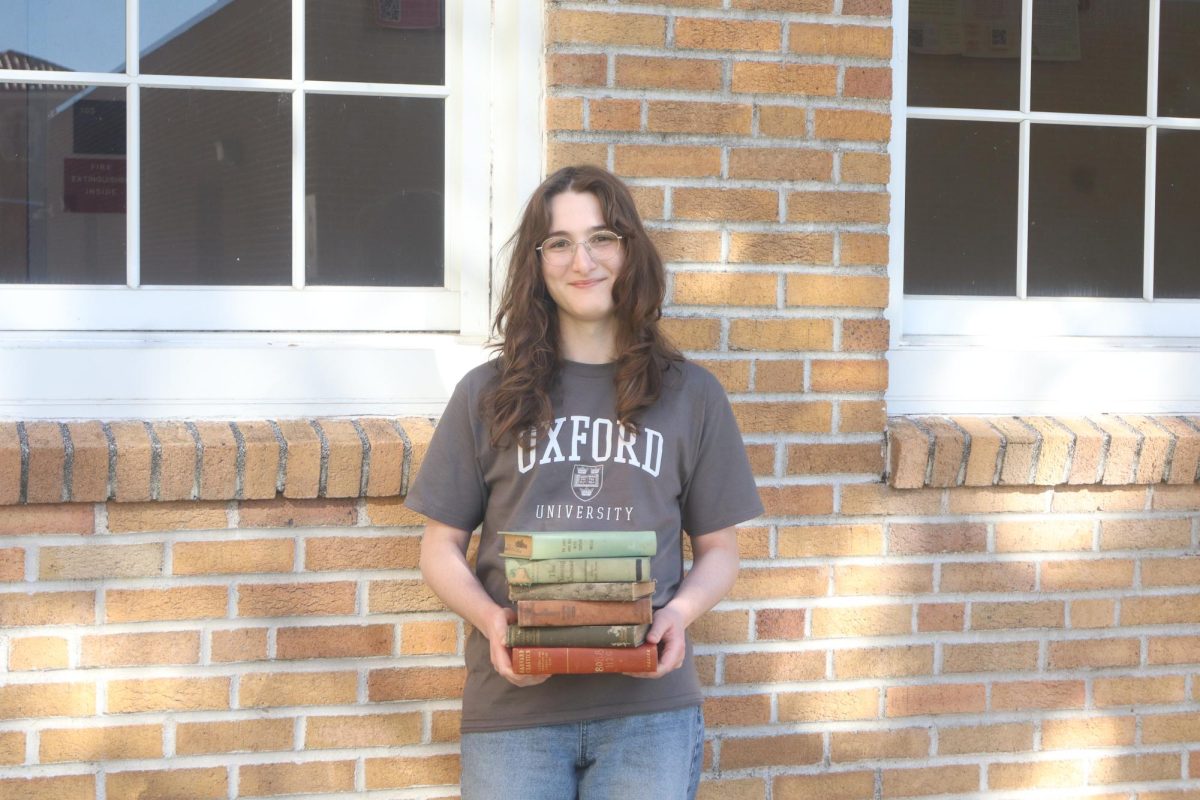 Ivory Geiger stands with various Latin books. She was admitted into Oxford on Jan. 13, 2026, after months of testing, writing and interviews. 