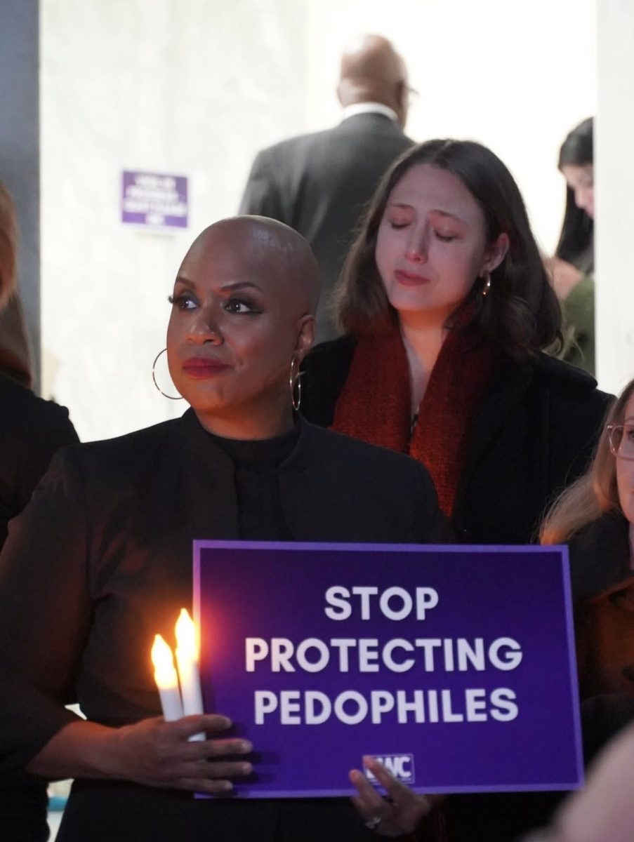 Rep. Ayanna Pressley speaks at a public event advocating for criminal justice reform and reproductive rights. Pressley has centered her political career on activist leadership and trauma-informed policy since her election to Congress in 2018. 