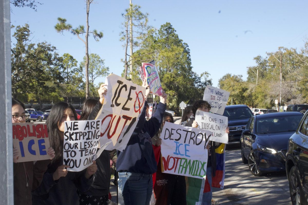 Students stand out front of Plant High School protesting the recent actions of ICE and the current administration's immigration policies in front of the school. The anti-ICE walkout occurred on Feb. 6 at 2:30 p.m., and students faced Himes Ave. with handmade signs expressing their protest.
