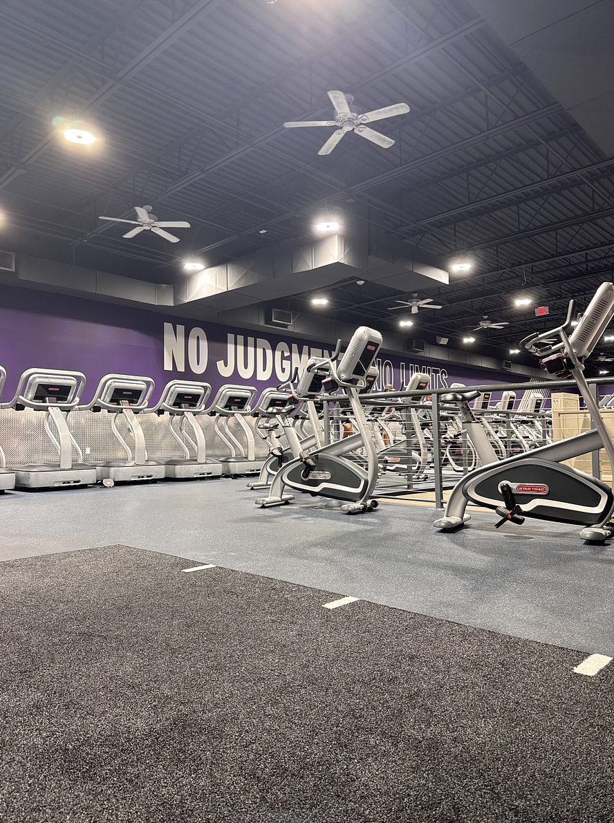 An empty gym sits ready for use, with running machines arranged across the workout floor. The absence of people highlighted a quiet moment in a space usually associated with routine, discipline and daily motivation.