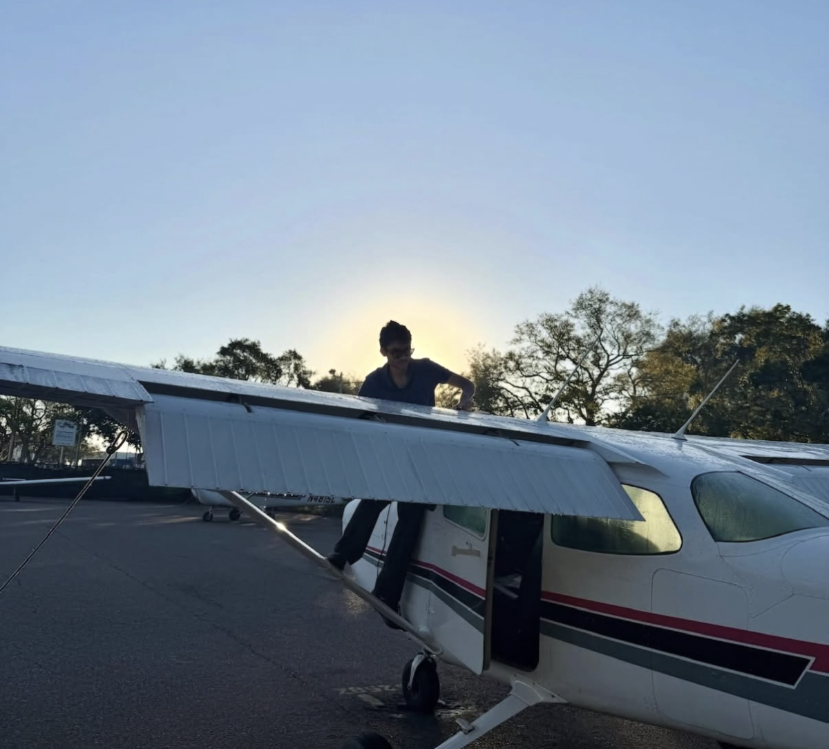 Ayaan Gupta is seen doing a preflight of a Cessna aircraft. Gupta logged over 70 flight instruction hours over the past four years. 