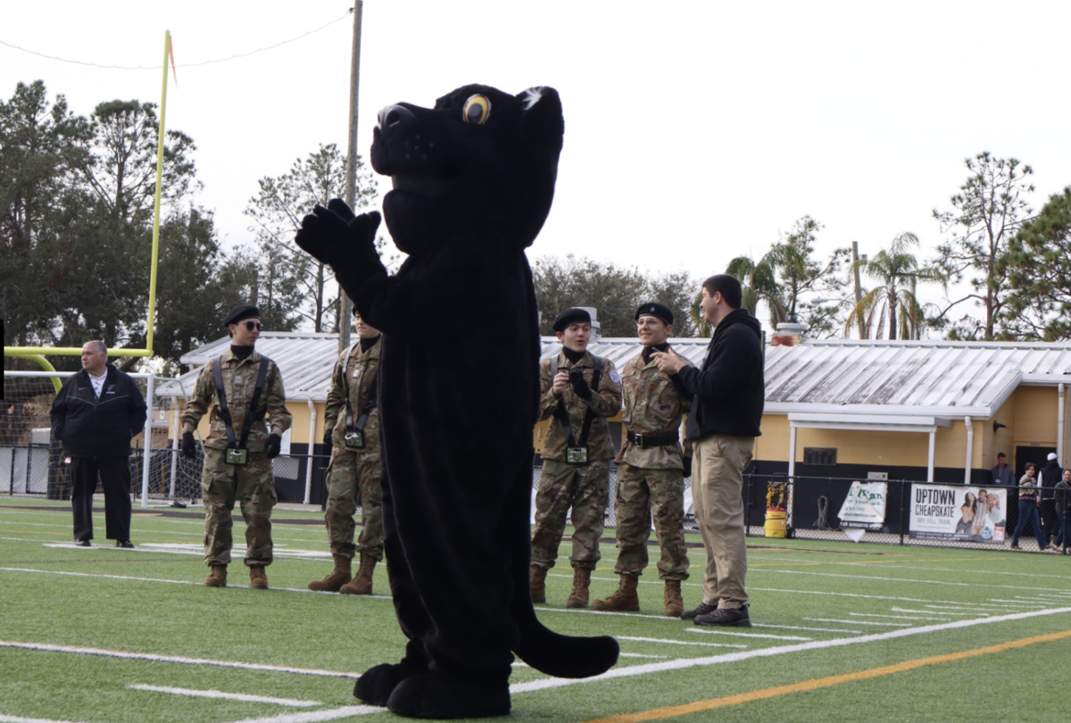 Patty the Panther cheers as the step team performs their routine for a fall Senior Night. Patty came out to show support to all of the celebrated seniors and their accomplishments throughout their time at Plant. 