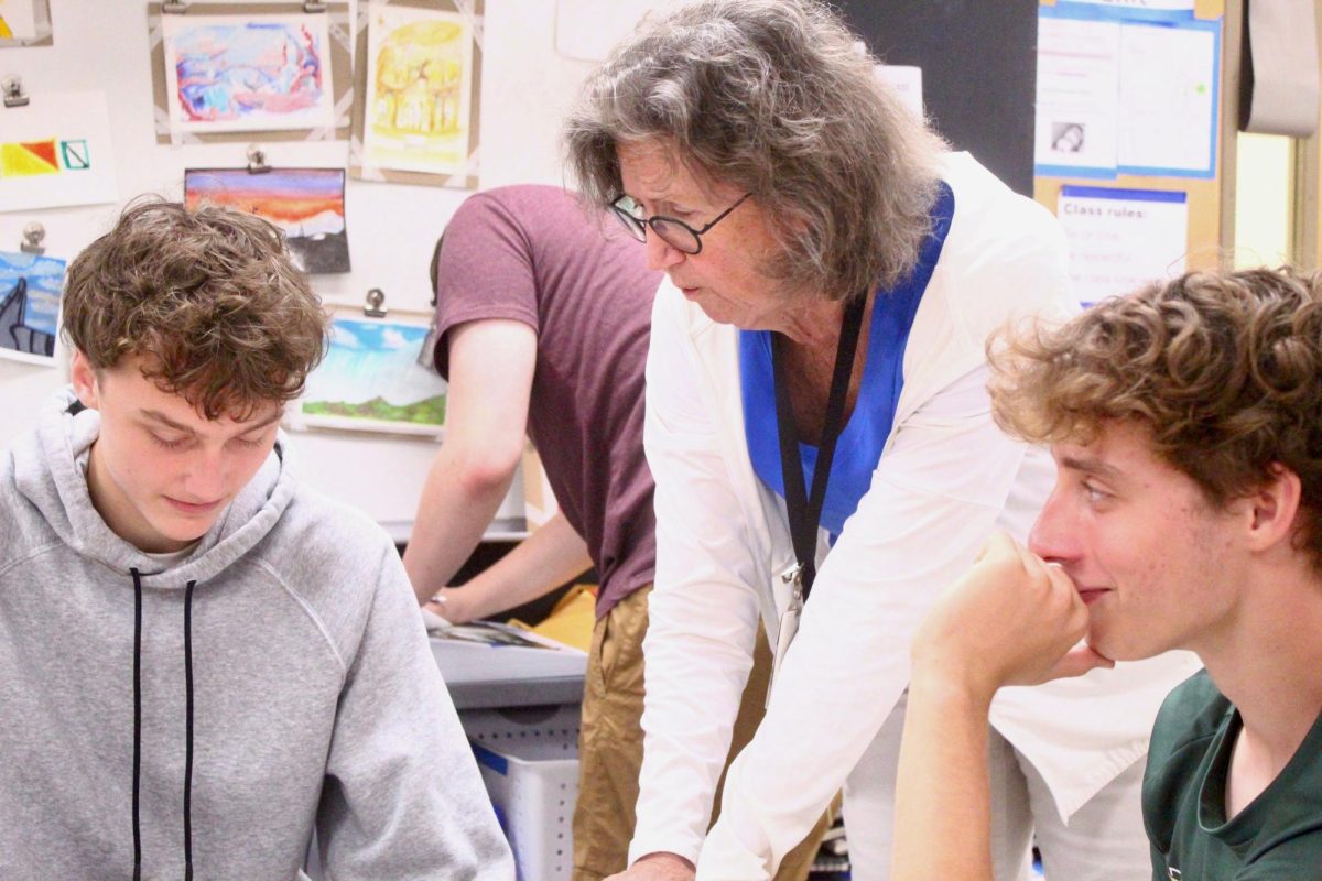 Katherine Johnson (middle) instructs two of her students as they work on projects for the end of the semester. Johnson was one of the six teachers that were cut from Plant High following the 2025-2026 school year.