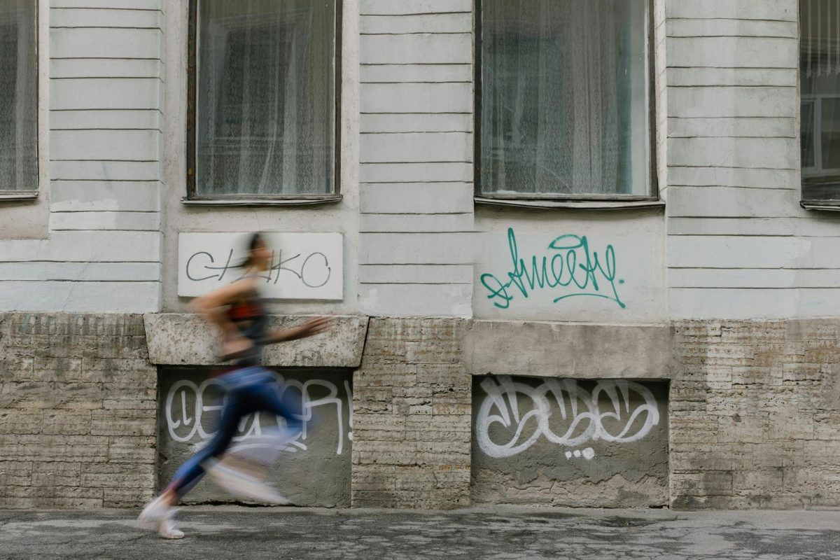 A woman runs to get to work as she doesn't want to be late but doesn't want to wake up early. Efficiency is something that can help us create but it can also lock us down in horrible patterns