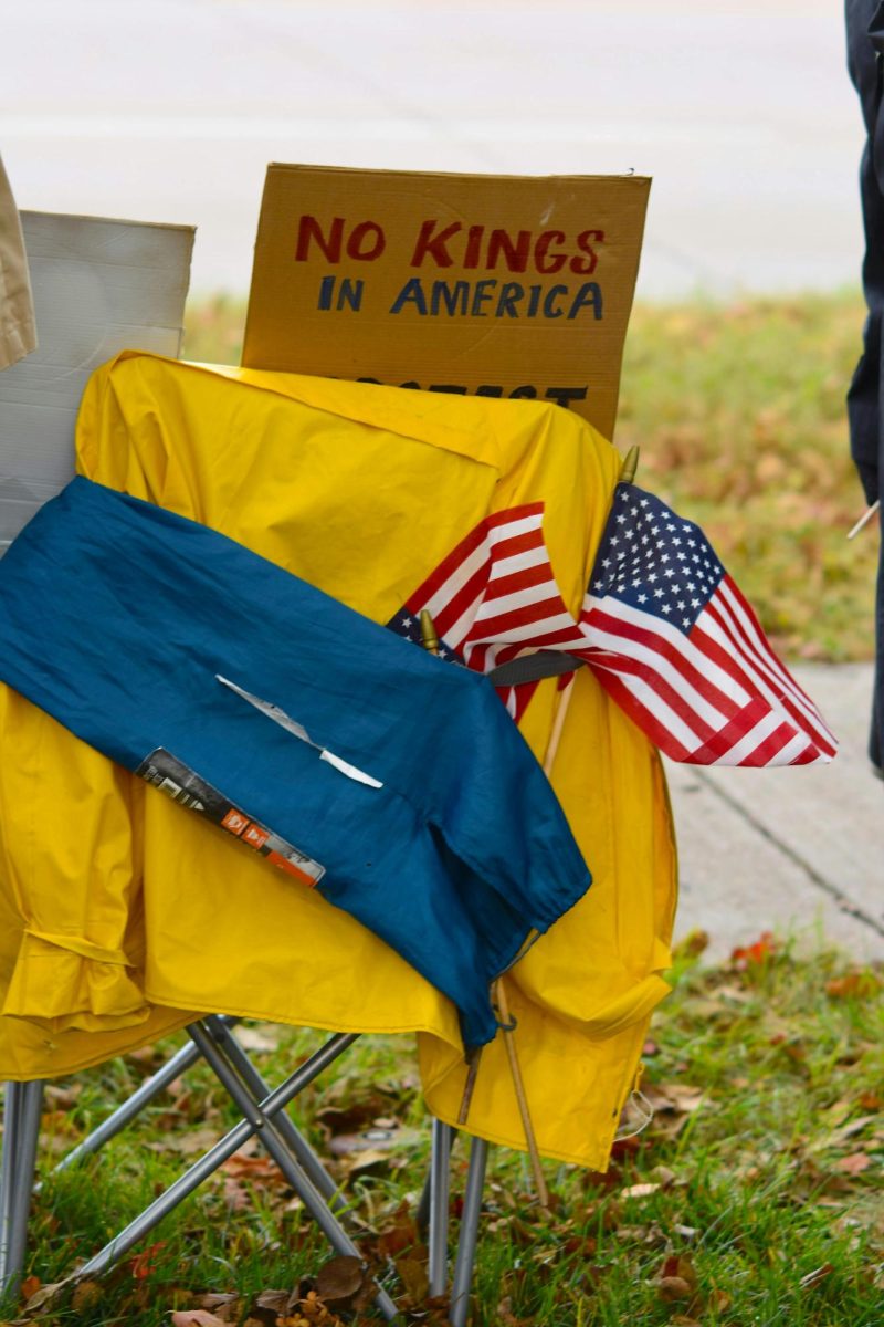 A chair with American flags and a poster signifying the No Kings movement is set up at a protest in St. Paul, Minn. Over 8 million protestors took part of the No Kings Protests on March 28, 2026. 
